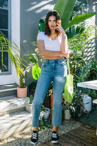 VINTAGE MID RISE SLIM STRAIGHT JEANS WITH RAW HEM